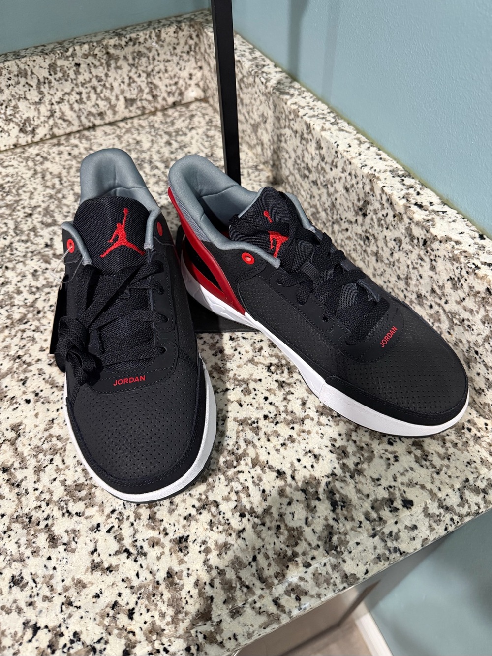 Jordan Kids Black Sneakers with Red and Gray Accents